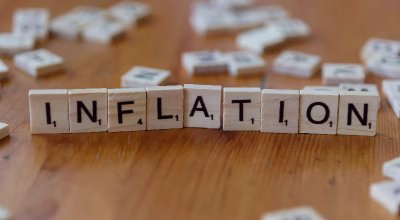 Illustration of inflation eroding investment returns: a hand holding a shrinking dollar bill above a rising CPI chart, with an upward inflation arrow and coin stack.